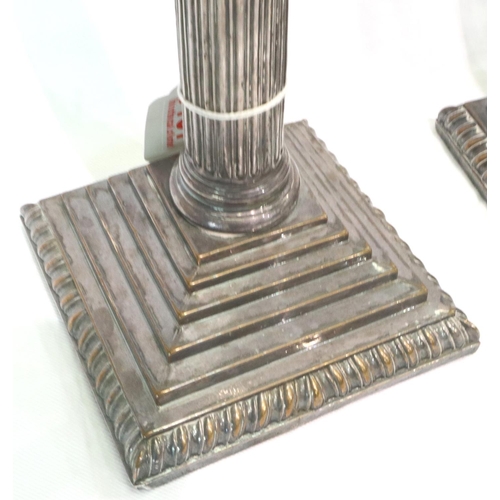 90 - Pair of Corinthian column silver plated candlesticks, each H: 34 cm. P&P Group 2 (£18+VAT for the fi... 