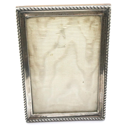 97 - Hallmarked silver photograph frame, Birmingham assay, 11 x 15 cm. P&P Group 1 (£14+VAT for the first... 