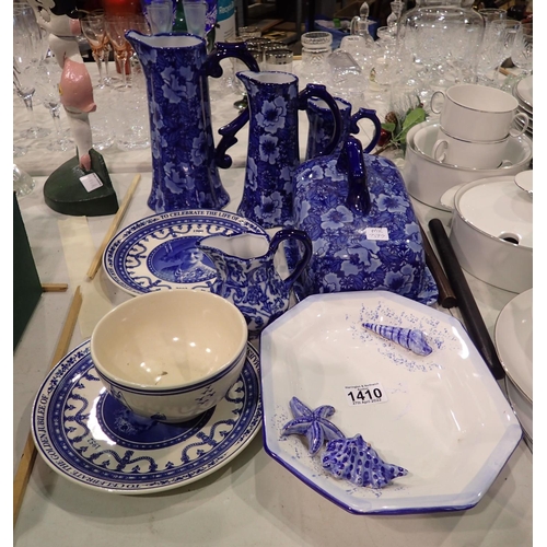 1410 - Ten pieces of mixed blue and white ceramics to include three graduated jugs. Not available for in-ho... 