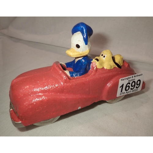 1699 - Cast iron Donald Duck and Pluto in a car, 16 x 10 cm H. P&P Group 2 (£18+VAT for the first lot and £... 