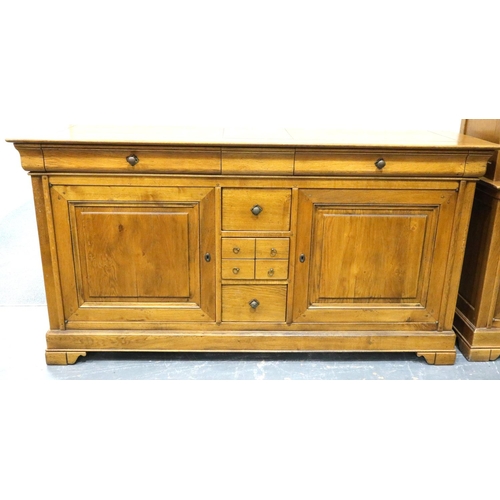 3102 - A substantial fruitwood sideboard/buffet having eight drawers of mixed sizes and two cupboard, 194 x... 