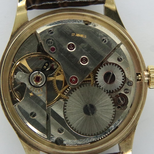 75 - Garrard; 9ct gold gents dress wristwatch with champagne dial and subsidiary seconds dial on leather ... 