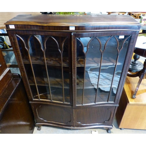 1514A - Early 20th century two door glazed bookcase with serpentine front, 105 x 27 x 153 cm. damage to lowe... 