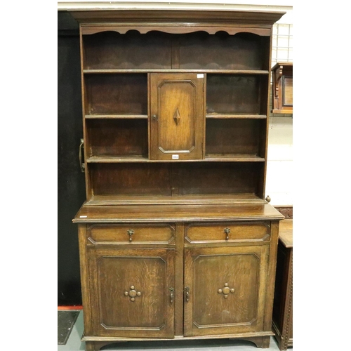 3082 - Early 20th century oak dresser, the slim plate rack with cupboard above sideboard base, 45 x 122 x 2... 