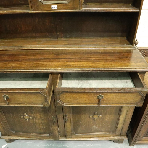 3082 - Early 20th century oak dresser, the slim plate rack with cupboard above sideboard base, 45 x 122 x 2... 