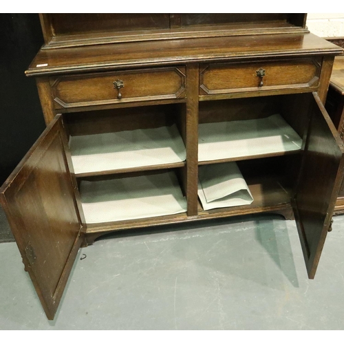 3082 - Early 20th century oak dresser, the slim plate rack with cupboard above sideboard base, 45 x 122 x 2... 