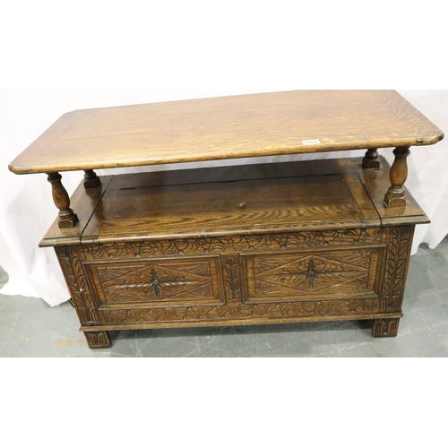 3084 - An early 20th century oak Monks bench with carved facias and panelled ends, 107 x 47 x 68 cm H. Not ... 