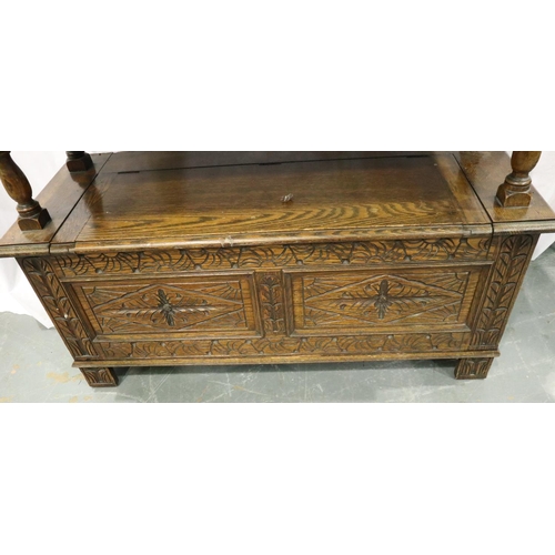 3084 - An early 20th century oak Monks bench with carved facias and panelled ends, 107 x 47 x 68 cm H. Not ... 