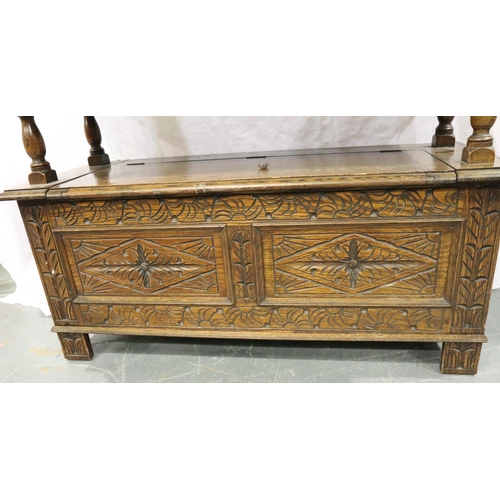 3084 - An early 20th century oak Monks bench with carved facias and panelled ends, 107 x 47 x 68 cm H. Not ... 