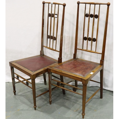 3086 - A pair of Arts and Crafts walnut chairs with studded red leather seats, joints are loose but no visi... 