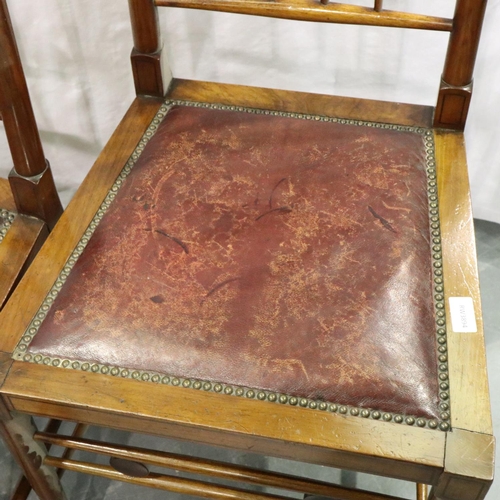 3086 - A pair of Arts and Crafts walnut chairs with studded red leather seats, joints are loose but no visi... 