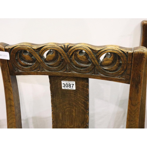 3087 - A set of three Victorian oak dining chairs, each with carved rails and backrests, and later upholste... 