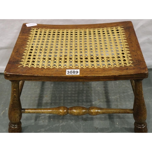 3089 - A 19th century elm framed stool with turned supports and stretchers, and a later canework top. Not a... 