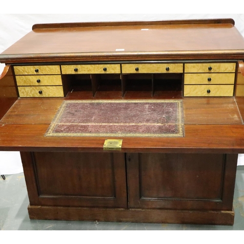 3092 - A Victorian mahogany secretaire, the fitted drawer with hinged writing surface above a two door cupb... 