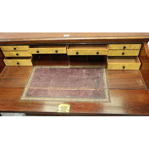 3092 - A Victorian mahogany secretaire, the fitted drawer with hinged writing surface above a two door cupb... 