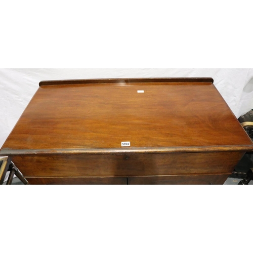 3092 - A Victorian mahogany secretaire, the fitted drawer with hinged writing surface above a two door cupb... 