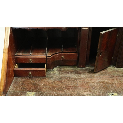 3095 - Mid 20th century walnut bureau, the fitted interior with hidden drawers and compartments above four ... 