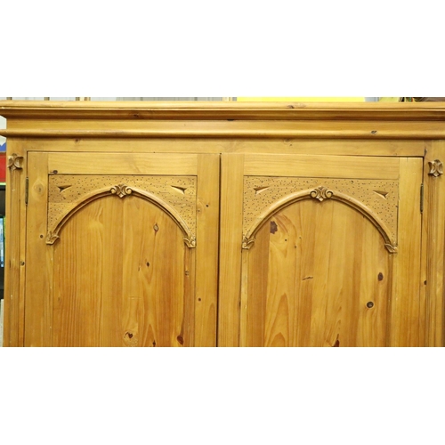 3107 - A contemporary suite of carved pine bedroom furniture comprising wardrobe, chest of five drawers, dr... 