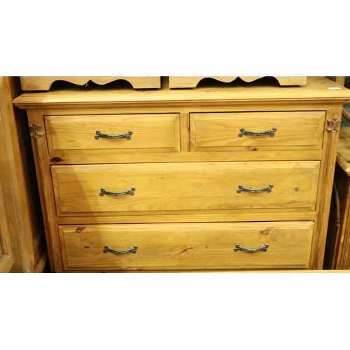 3107 - A contemporary suite of carved pine bedroom furniture comprising wardrobe, chest of five drawers, dr... 