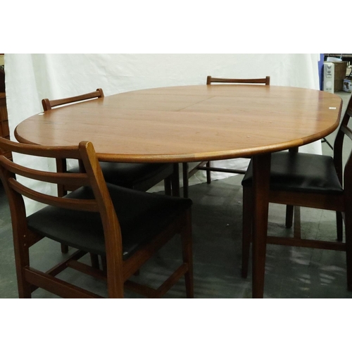 3122 - A Younger? mid 20th century Danish teak extending dining table with metamorphic leaf and a set of fo... 