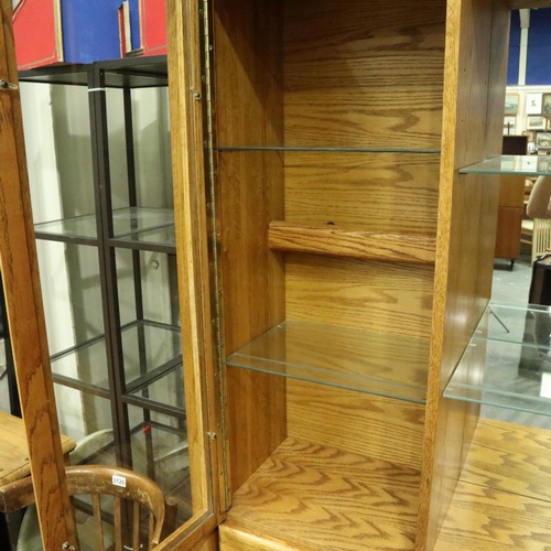 3125 - Substantial oak sideboard with four cupboards, having a three-drawer top-section with display shelve... 