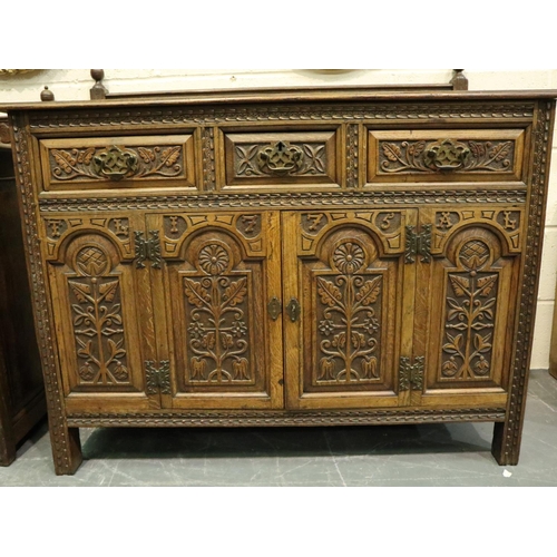 3131 - Early 20th century oak cabinet, heavily carved in the Jacobean manner, having three short drawers an... 