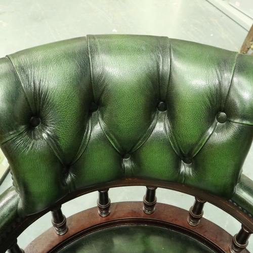 3104 - Mahogany and green leather button back swivel office chair. Not available for in-house P&P, contact ... 