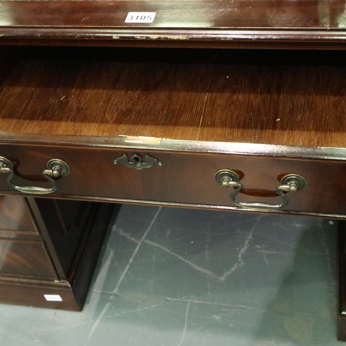 3105 - Reproduction mahogany twin pedestal writing desk having eight drawers and tooled green leather inset... 