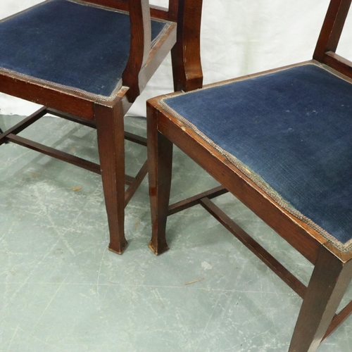 3128 - A pair of oak framed Arts and Crafts period elbow chairs, each with upholstered seat and headrest, e... 