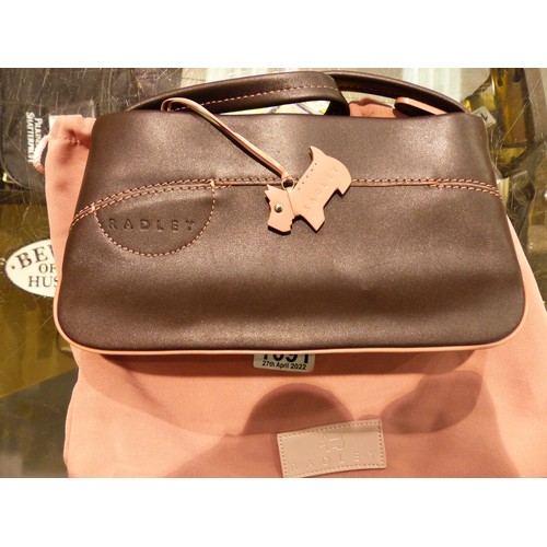 1091 - Brown leather Radley clutch bag with strap and pink stitching, dust bag present, L: 22 cm. P&P Group... 