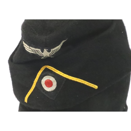 2105 - German WWII re-enactment SS Panzer Division cap, and M35 ski cap (2). P&P Group 2 (£18+VAT for the f... 