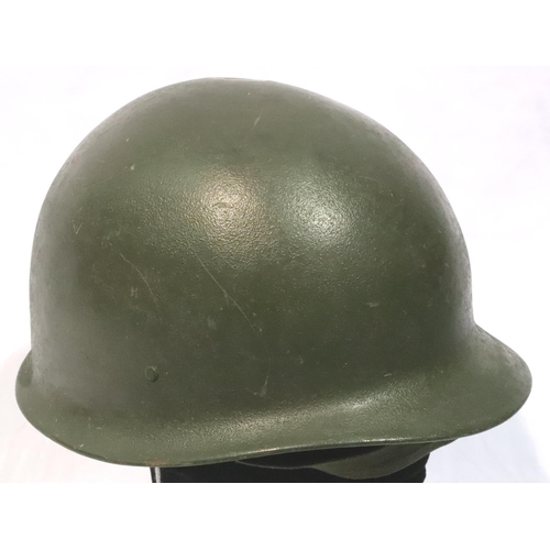 2116 - Vietnam War period American helmet with liner and chin strap. P&P Group 2 (£18+VAT for the first lot... 