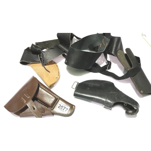 2077 - Two pistol shoulder holsters and two leather holsters (4). P&P Group 2 (£18+VAT for the first lot an... 