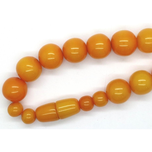 71 - Butterscotch real amber necklace with strong string screw, L: 42 cm, largest bead D: 15 mm. P&P Grou... 