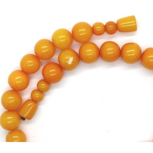 71 - Butterscotch real amber necklace with strong string screw, L: 42 cm, largest bead D: 15 mm. P&P Grou... 