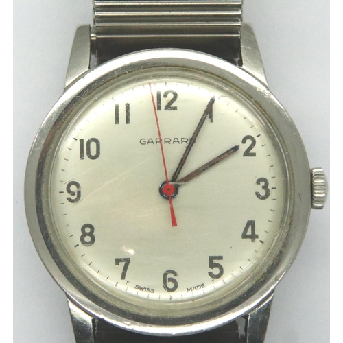 83 - Garrard: 1960s gents manual wind steel cased wristwatch on expanding bracelet, ICI inscription to ba... 