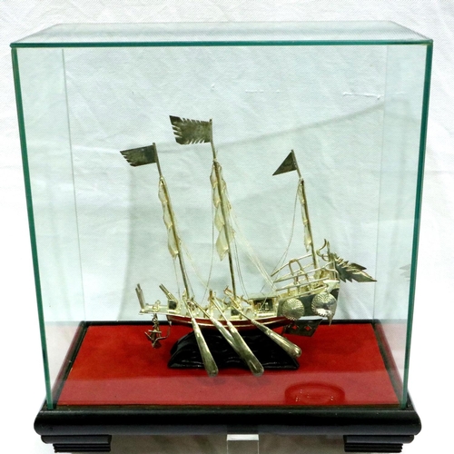 98 - White metal Chinese war junk in glass case, 145g. P&P Group 2 (£18+VAT for the first lot and £3+VAT ... 