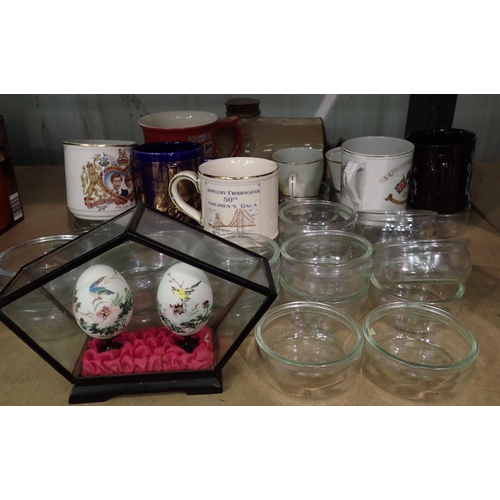 1130 - Quantity of glass ramekins (30), a stoneware hot water bottle and a quantity of Commemorative mugs. ... 