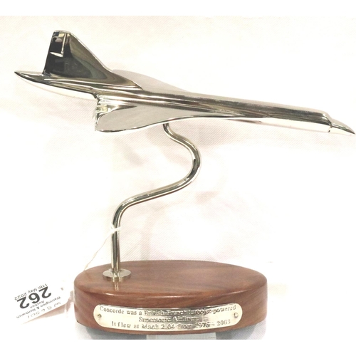 262 - Chrome Concorde on wooden base, wingspan 10 cm. P&P Group 1 (£14+VAT for the first lot and £1+VAT fo... 