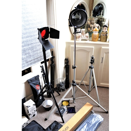 293 - A large quantity of studio lighting equipment to include lights, tripods, reflectors, umbrellas etc.... 