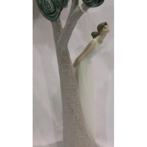 208 - Nao: an unusual figurine of a girl standing beside a tree, model no 1639, H: 38 cm. P&P Group 3 (£25... 