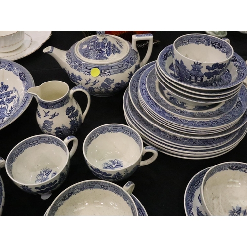 213 - Quantity of Wedgwood ceramics in the Willow pattern including tureens. No cracks, chips or visible r... 