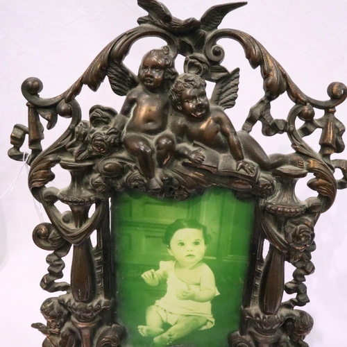 270 - Vintage metal photograph frame with Cherub decoration, H: 37 cm. P&P Group 3 (£25+VAT for the first ... 