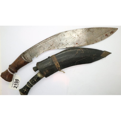 2198 - Sheathed kukri with skinning knives and a larger kukri. Larger kukri is 30 cm, has age related marks... 