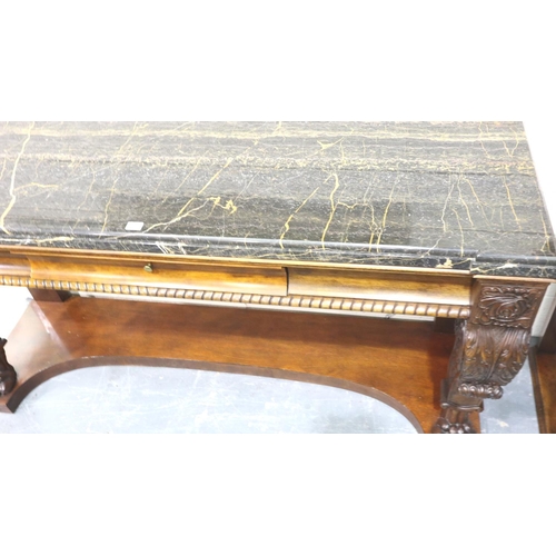 3114 - Henredon: a substantial modern American Empire style console table having heavily carved supports, s... 