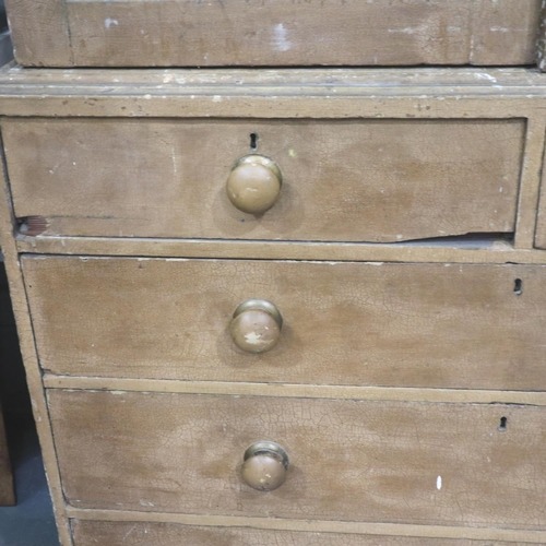 3123 - A Victorian pine linen press with a chest base of two short above three long drawers, the cupboard f... 