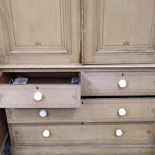 3124 - A Victorian pine linen press with a chest base of two short above two long drawers, the cupboard fit... 