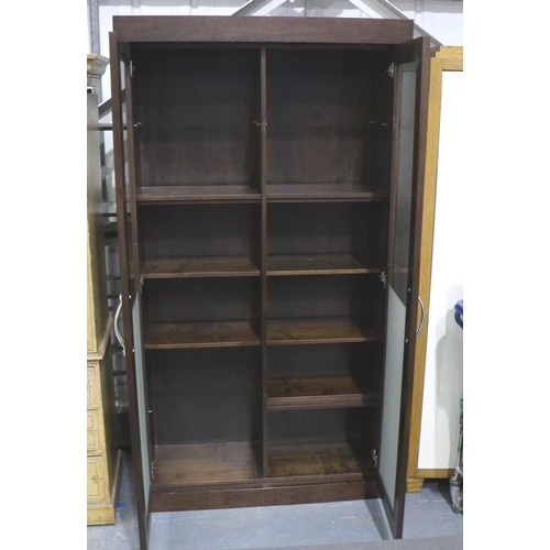 3125 - A contemporary darkwood two door bookcase with half frosted glass and eleven adjustable shelves, 120... 