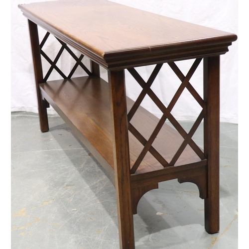 3132 - A contemporary end or console table, having latticed end panels and under shelf, 105 x 46 x 75 cm H.... 