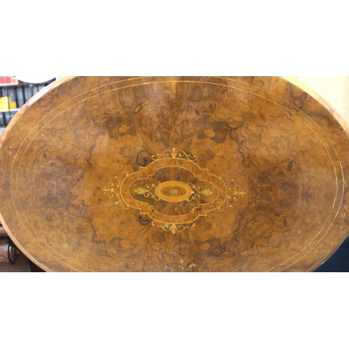 3133 - A late 19th century inlaid walnut lamp table, with restored oval top and carved tripod support H: 62... 